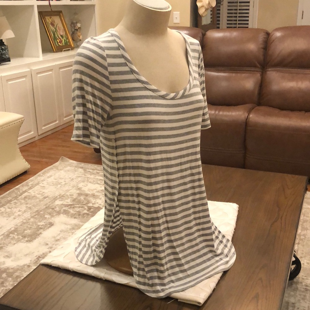 Grey/white striped t shirt; scoop neck & side vents with button details